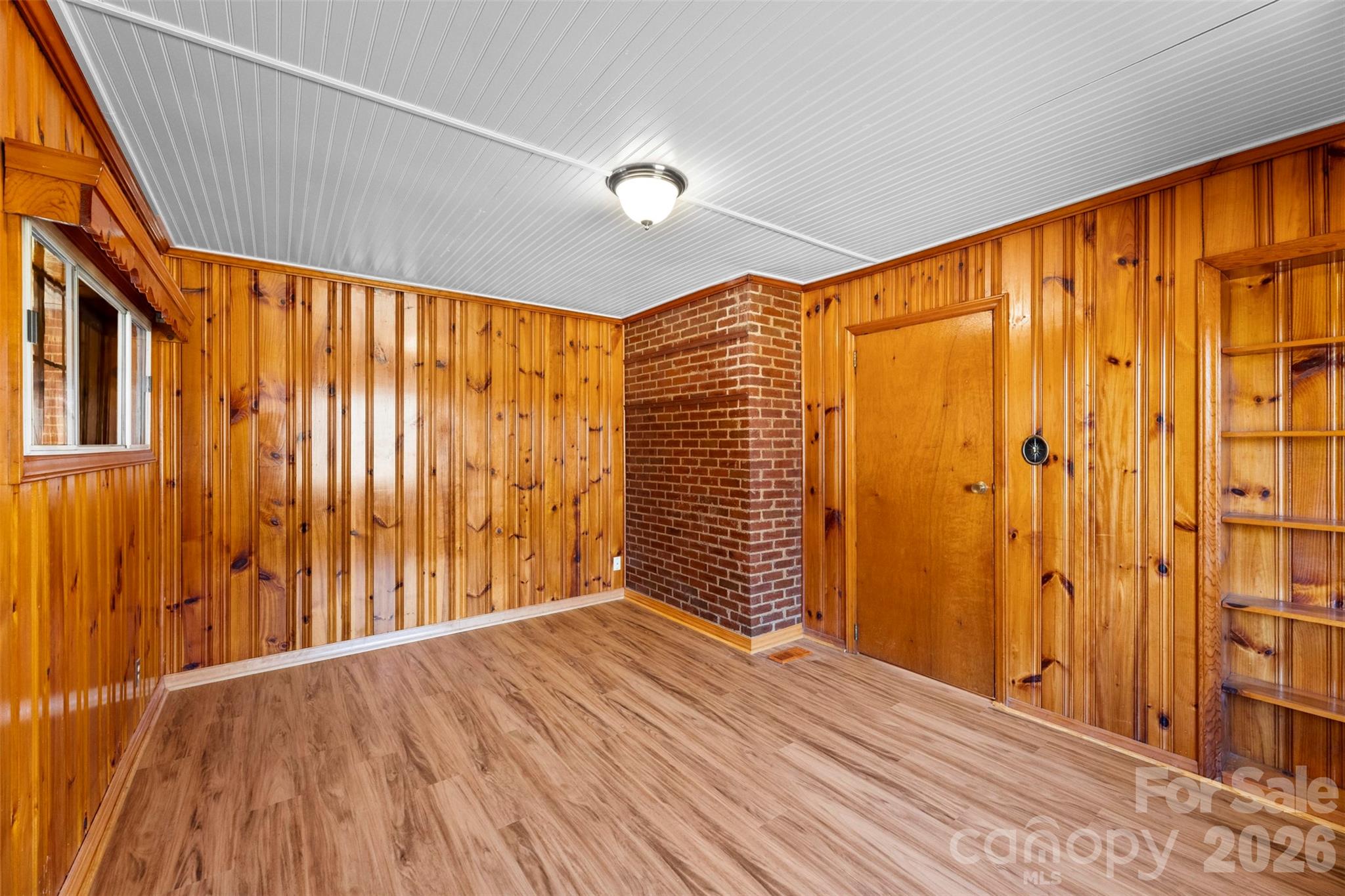 845 St Marks Church Road Cherryville, NC 28021 - Photo 21 of 47 a view of an empty room with wooden floor and a window