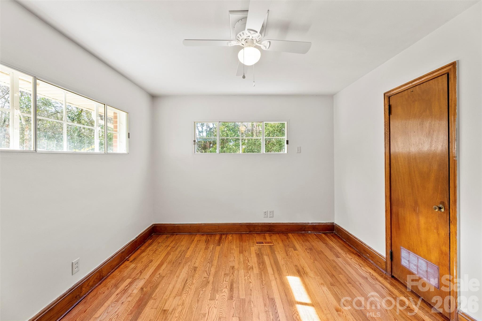 845 St Marks Church Road Cherryville, NC 28021 - Photo 29 of 47 wooden floor in an empty room with a window