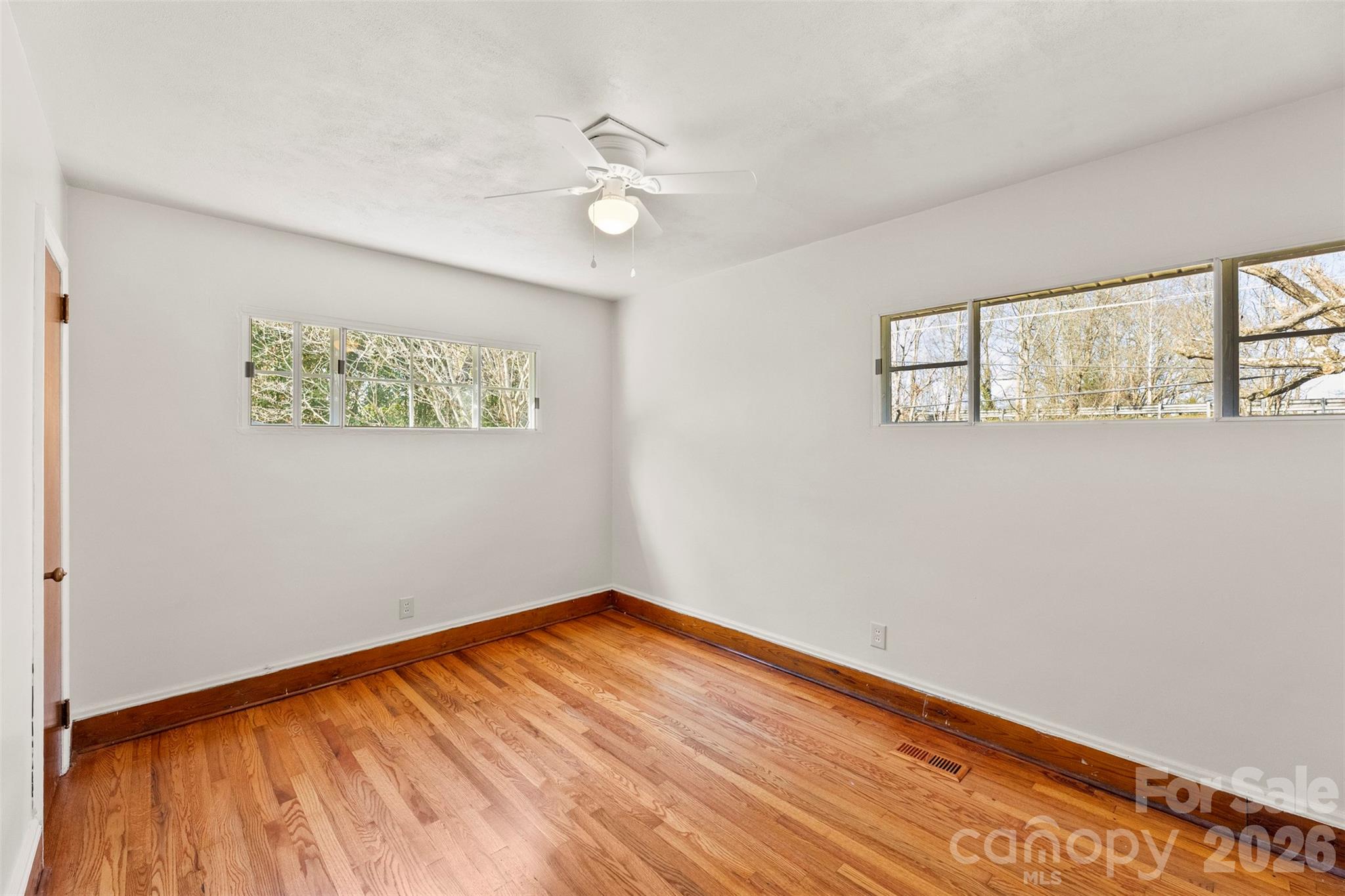 845 St Marks Church Road Cherryville, NC 28021 - Photo 33 of 47 a view of empty room with wooden floor and fan