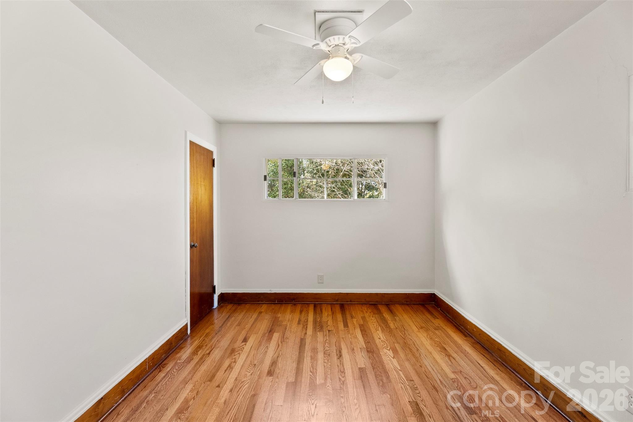 845 St Marks Church Road Cherryville, NC 28021 - Photo 34 of 47 an empty room with wooden floor and windows