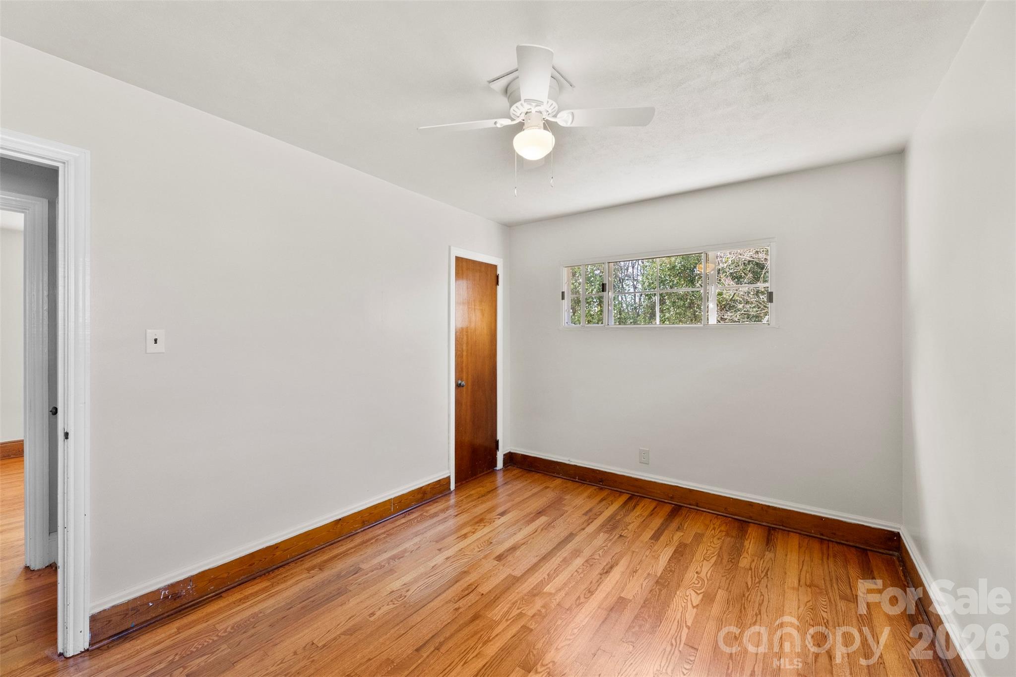 845 St Marks Church Road Cherryville, NC 28021 - Photo 35 of 47 an empty room with wooden floor and windows