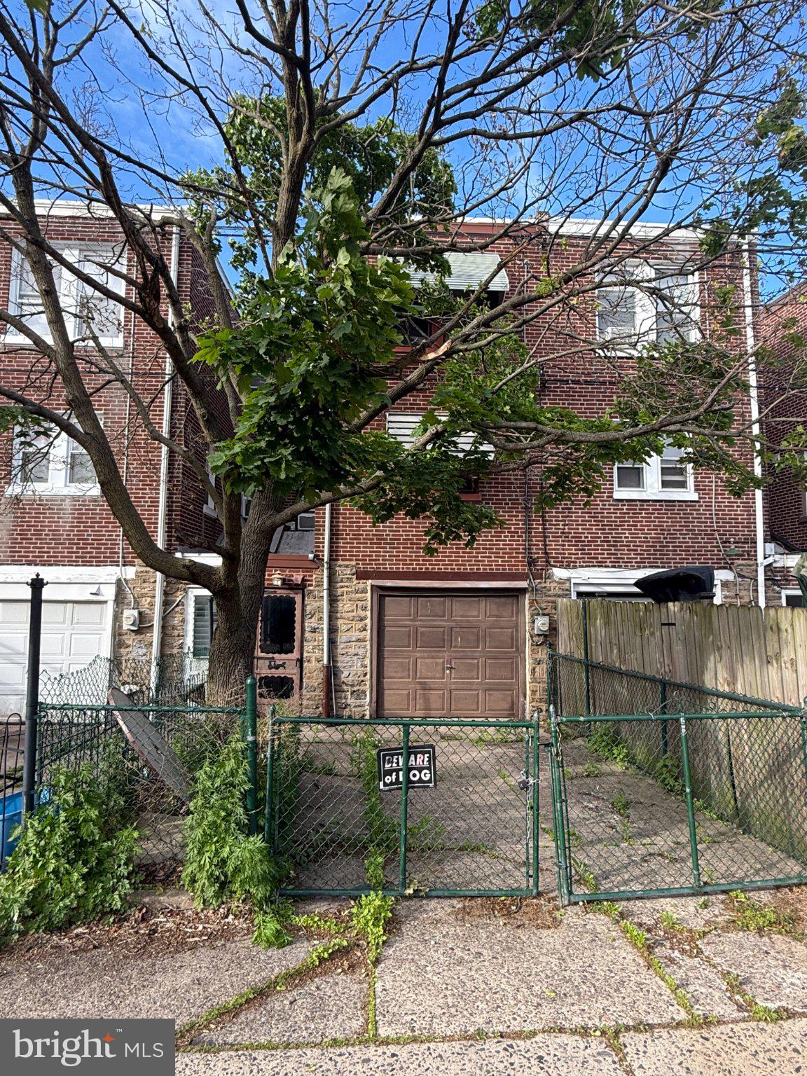 3148 Rawle Street Philadelphia, PA 19149 - Photo 33 of 33 Charming brick home with lush greenery.