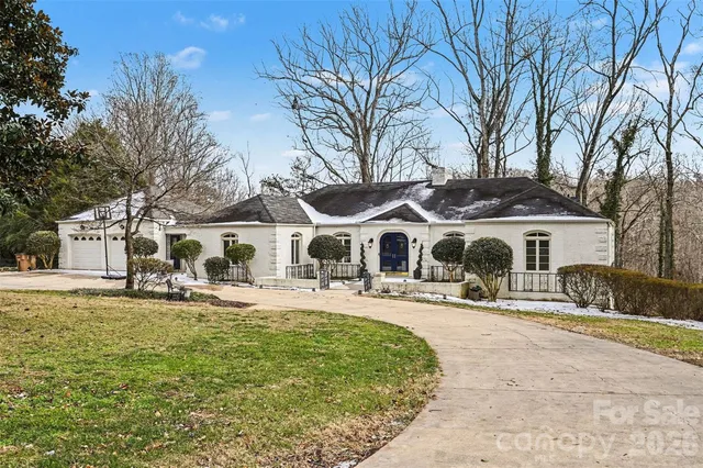 a front view of a house with a yard patio and fire pit