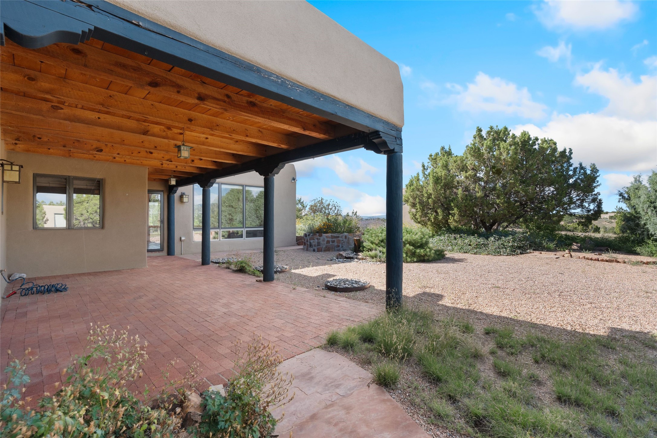 71 Camerada Loop Santa Fe, NM 87508 - Photo 17 of 35 Covered portal off main house