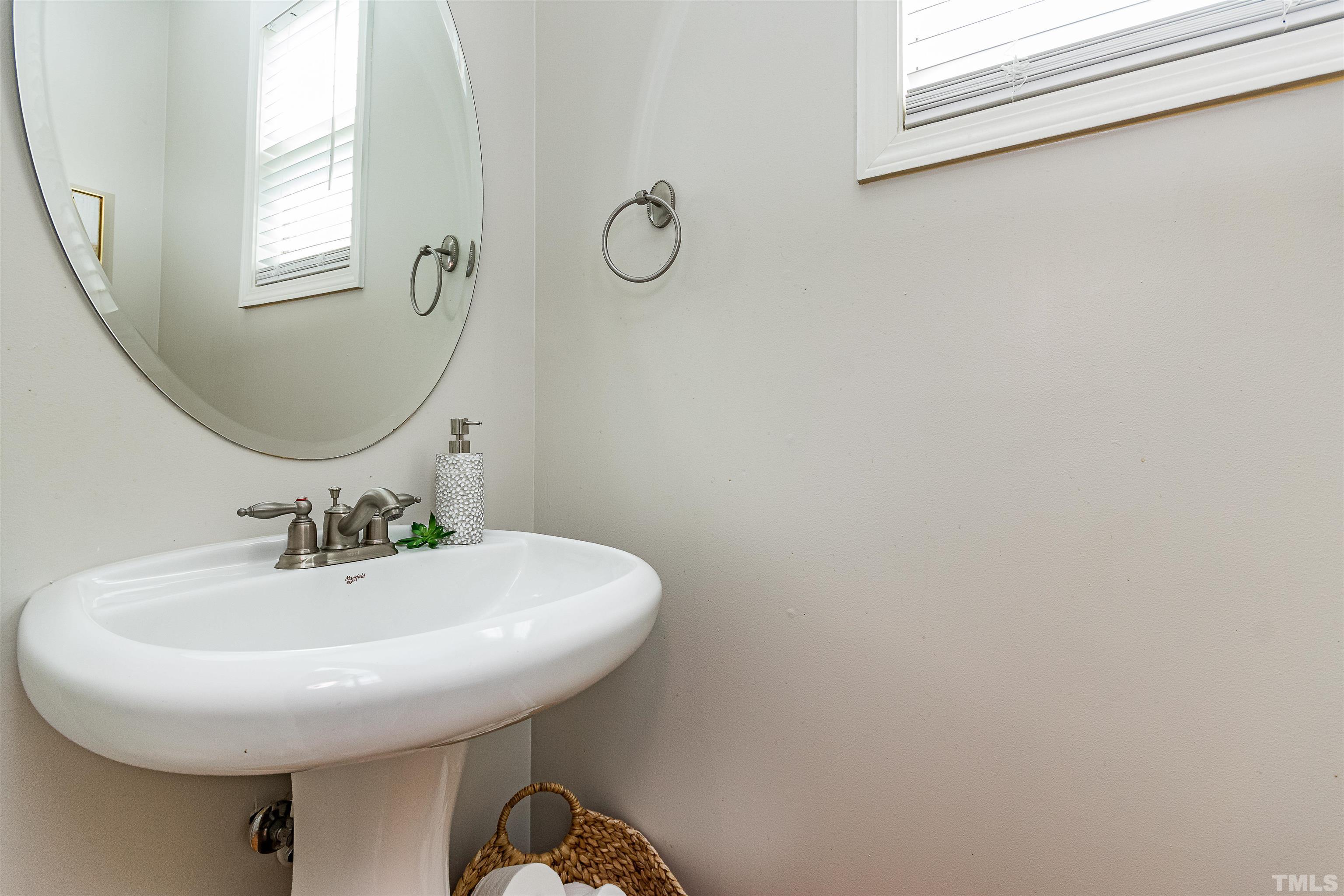 9009 Cornwell Drive Wake Forest, NC 27587 - Photo 15 of 36 a bathroom with a sink and a mirror