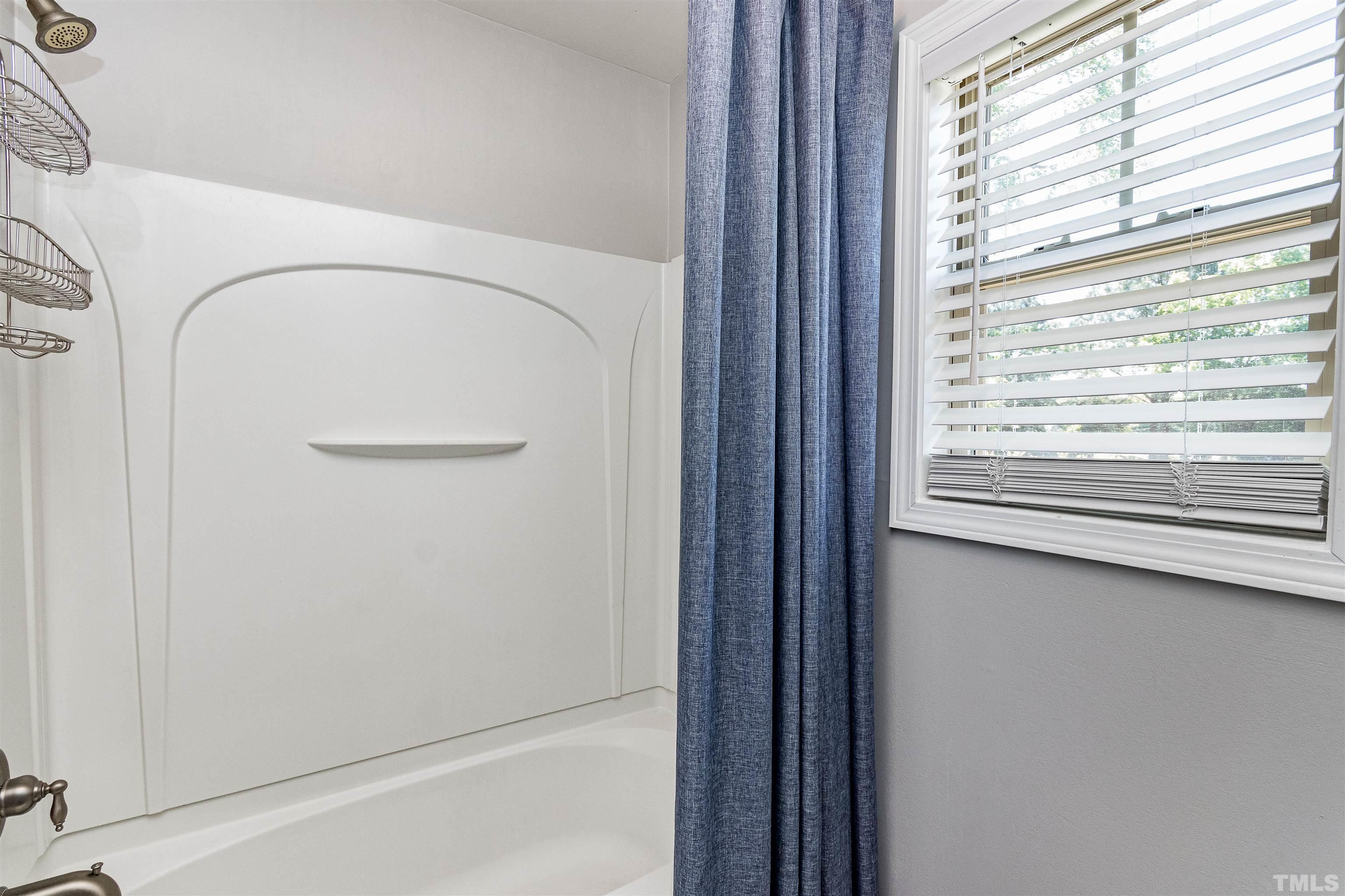 9009 Cornwell Drive Wake Forest, NC 27587 - Photo 20 of 36 a view of a closet area with a window
