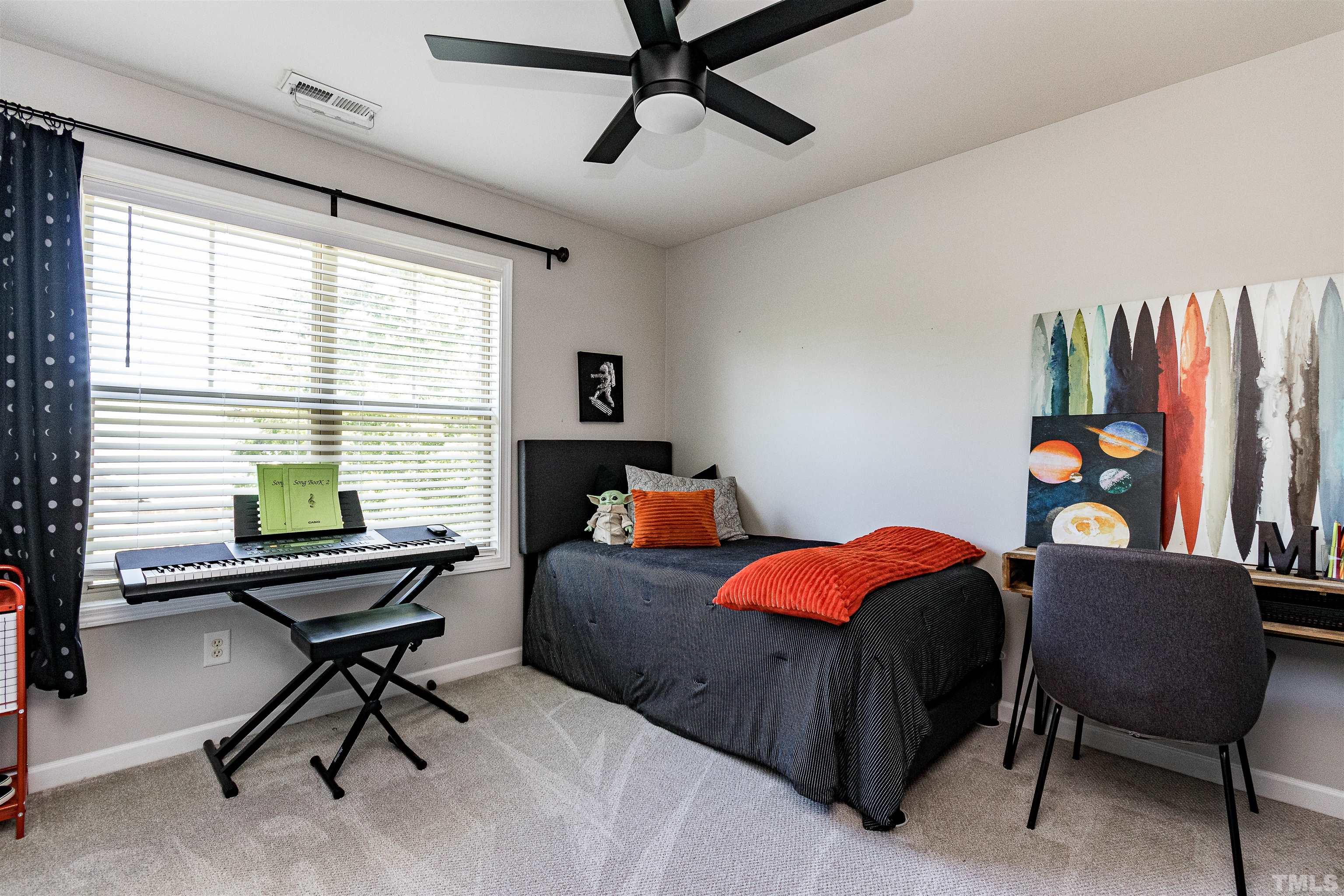 9009 Cornwell Drive Wake Forest, NC 27587 - Photo 21 of 36 a bedroom with furniture and a window