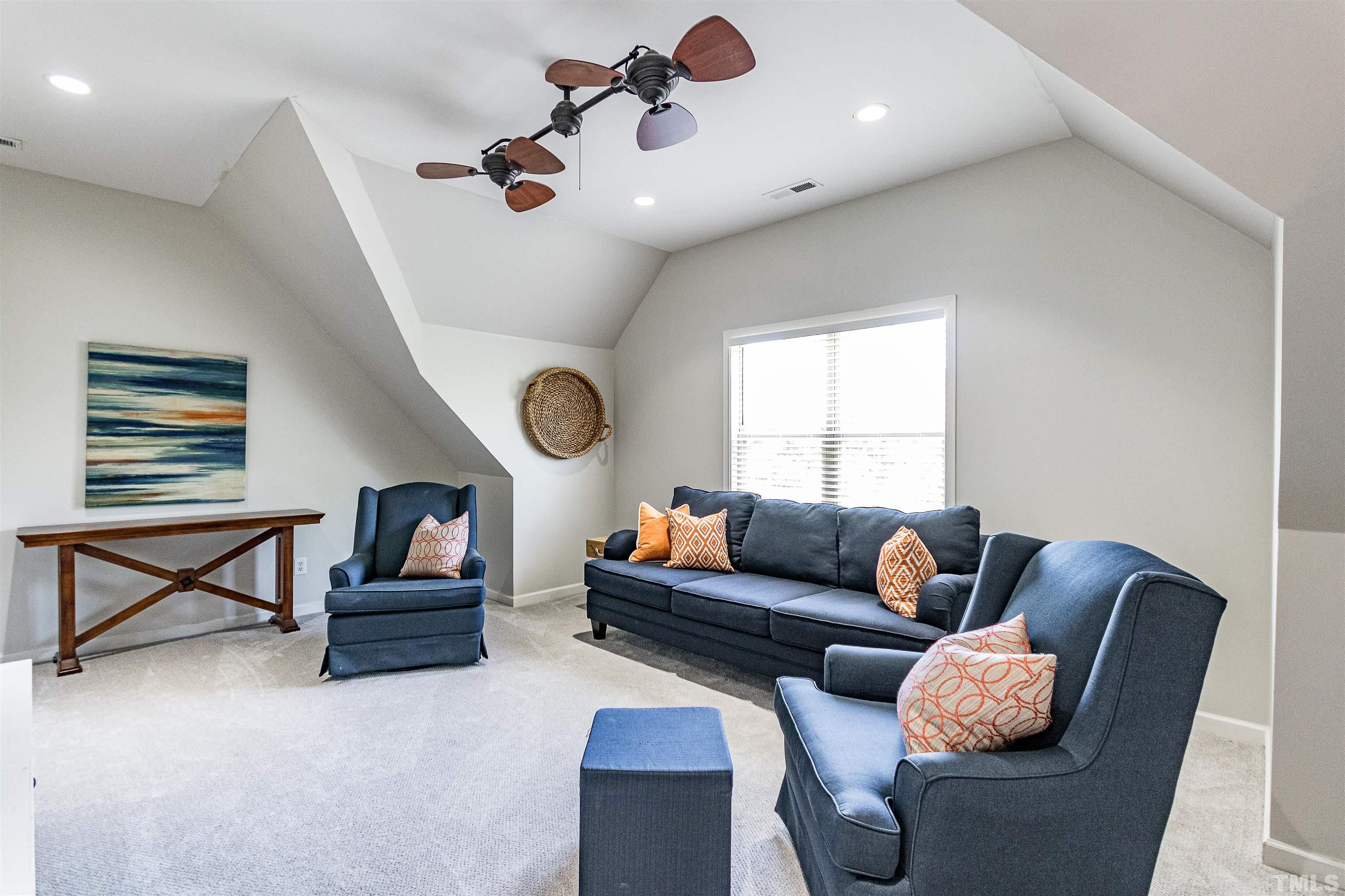 9009 Cornwell Drive Wake Forest, NC 27587 - Photo 22 of 36 a living room with furniture and a window