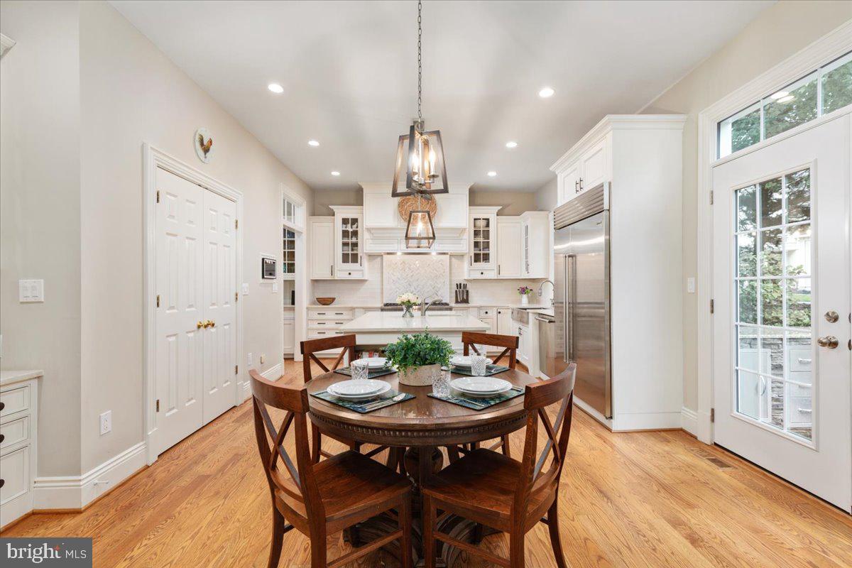 14915 Alpine Bay Loop Gainesville, VA 20155 - Photo 12 of 105 a view of a dining room with furniture window and wooden floor