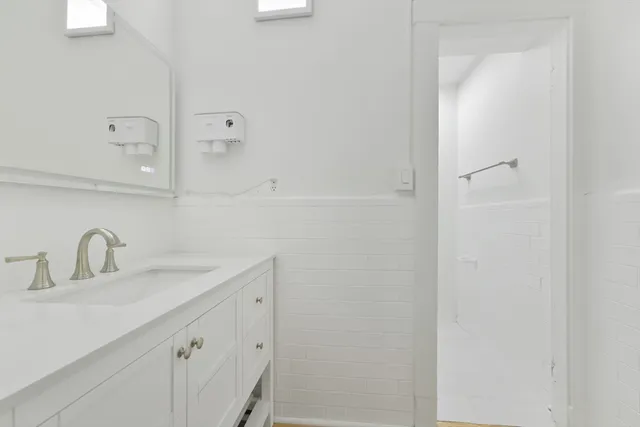 a bathroom with a sink and mirror