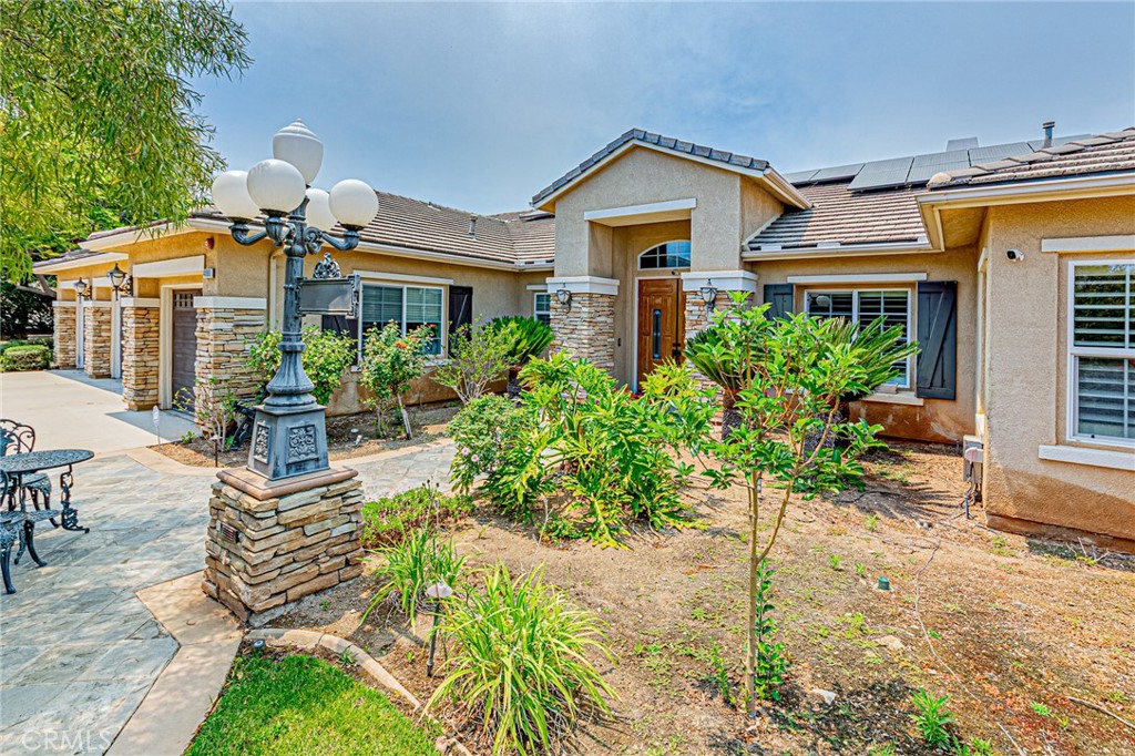4088 Shady Ridge Circle Corona, CA 92881 - Photo 9 of 47 a front view of a house with a yard