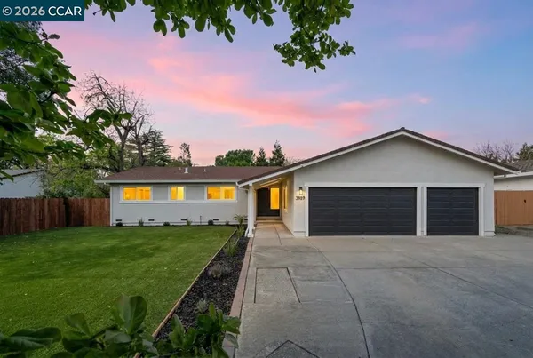 front view of a house with a yard