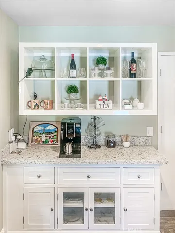 a view of cabinet with white cabinets