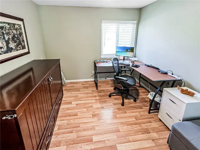 a workspace with furniture and a window