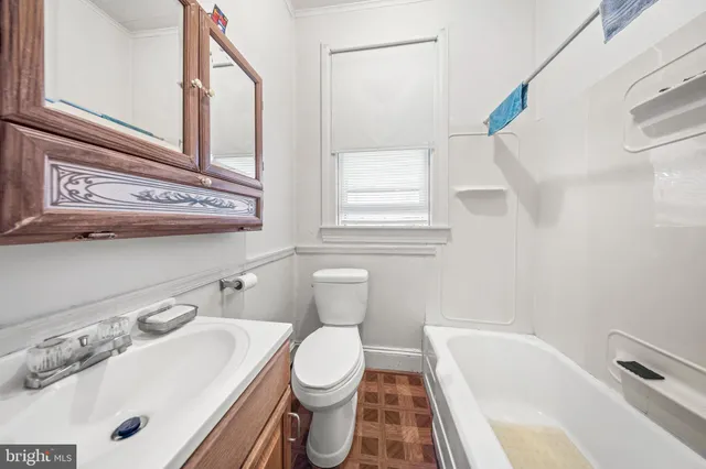 a bathroom with a sink and a toilet