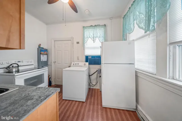 a kitchen with a refrigerator a sink and dishwasher