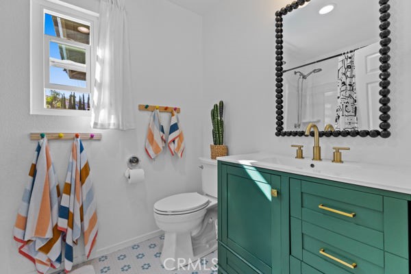 26932 St Julian Circle Murrieta, CA 92563 - Photo 22 of 37 a bathroom with a toilet sink and mirror