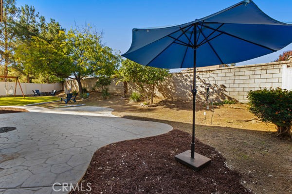 26932 St Julian Circle Murrieta, CA 92563 - Photo 28 of 37 a umbrella sitting in the middle of a yard