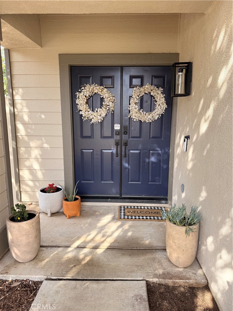 26932 St Julian Circle Murrieta, CA 92563 - Photo 34 of 37 a table with a potted plant and a vase
