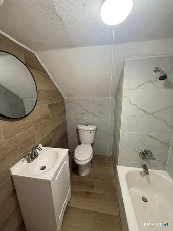 view of a storage and utility room with a sink