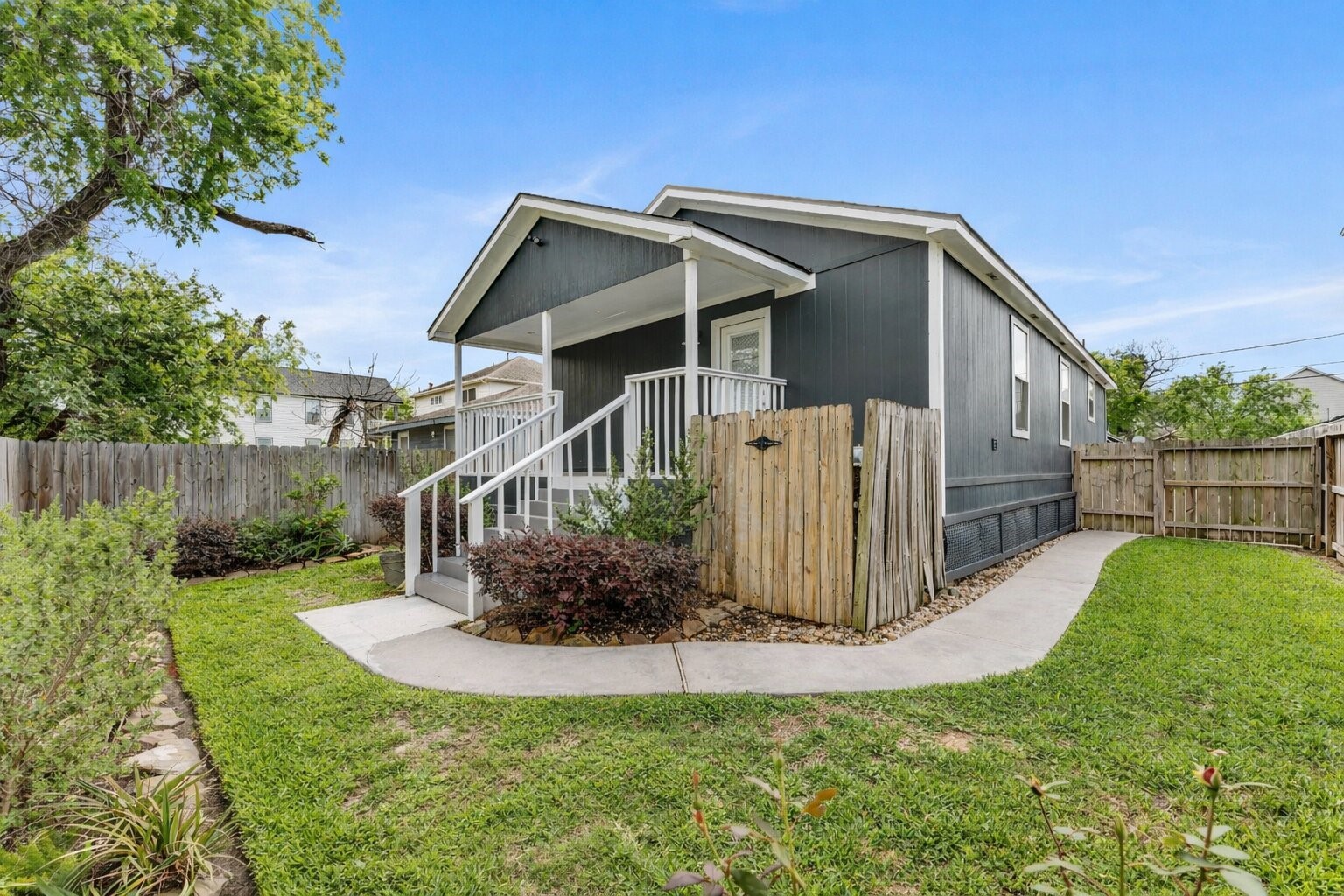 809 East 40th Street Houston, TX 77022 - Photo 13 of 13 Fully fenced backyard with a full front & back in-ground sprinkler system and a 1-year-old roof offers both convenience and peace of mind. This super cute bungalow in Independent Heights also features a covered patio area perfect for relaxing outdoors.