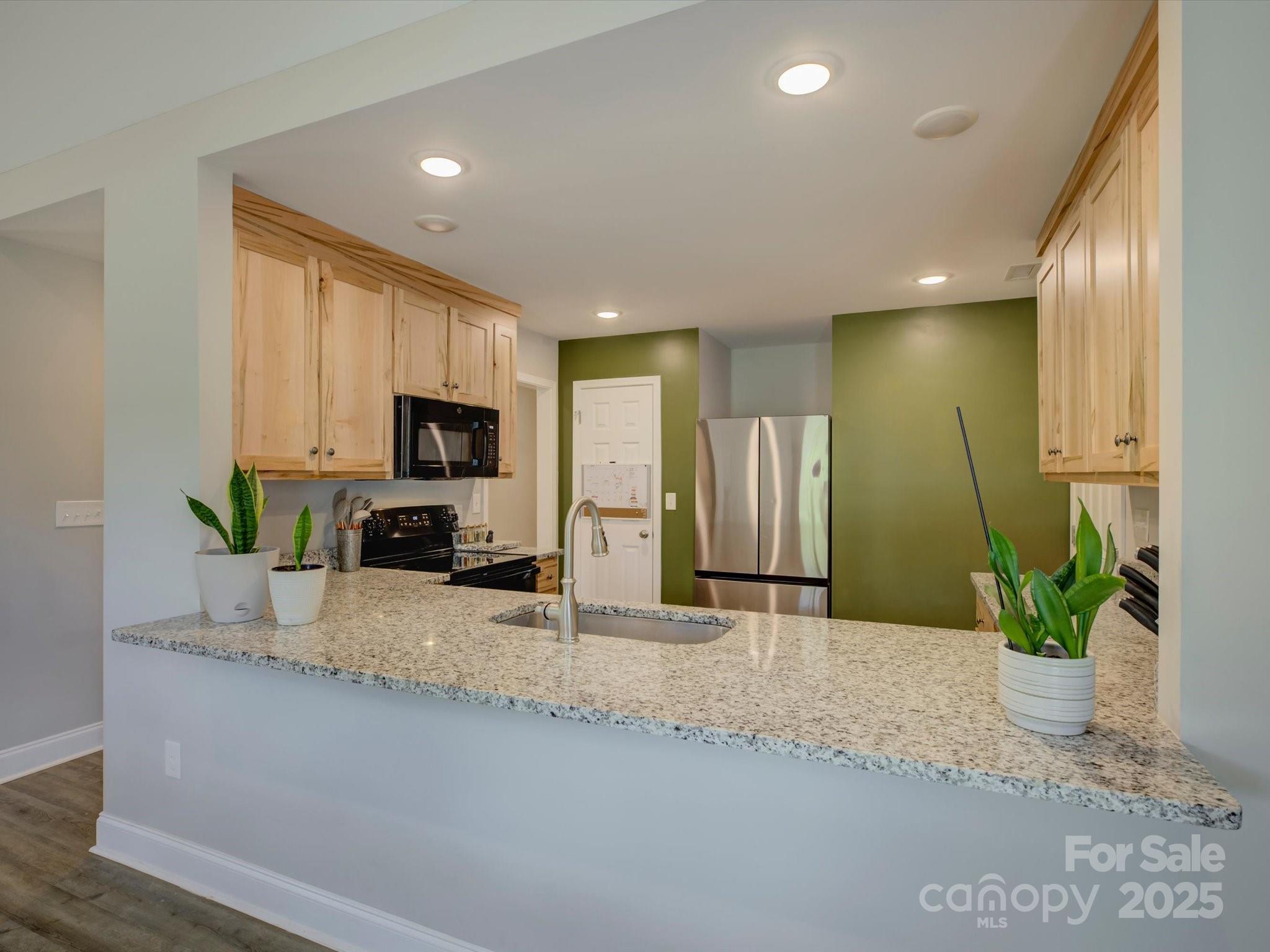 1454 King Road York, SC 29745 - Photo 11 of 34 a view of a kitchen with a sink and a living room