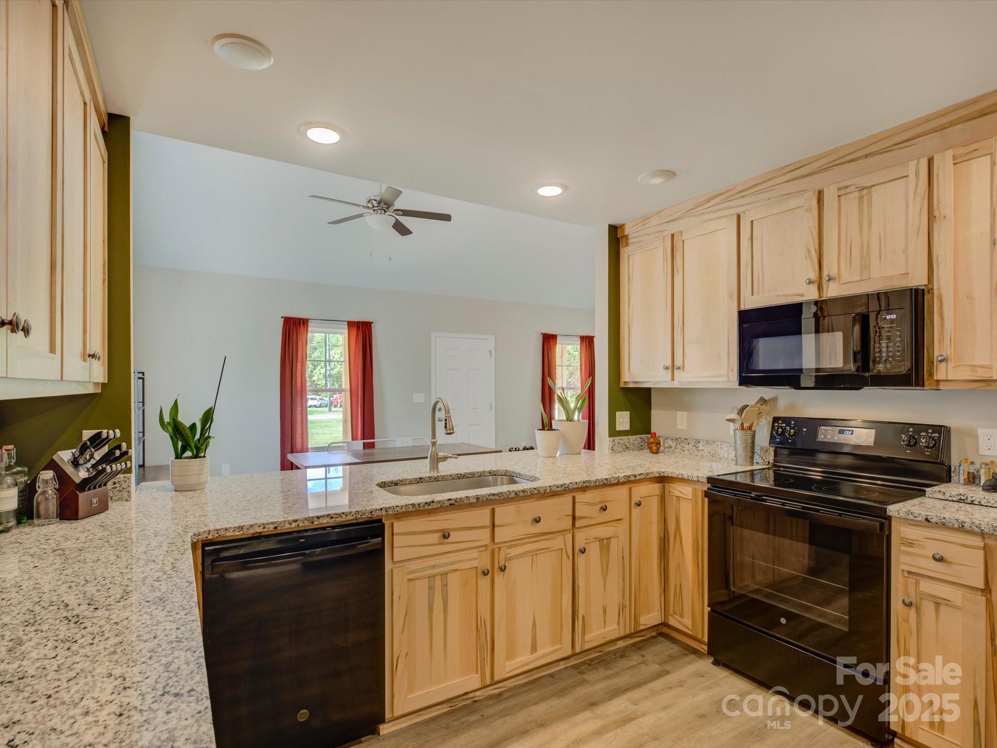 1454 King Road York, SC 29745 - Photo 13 of 34 a kitchen with a sink stove and microwave