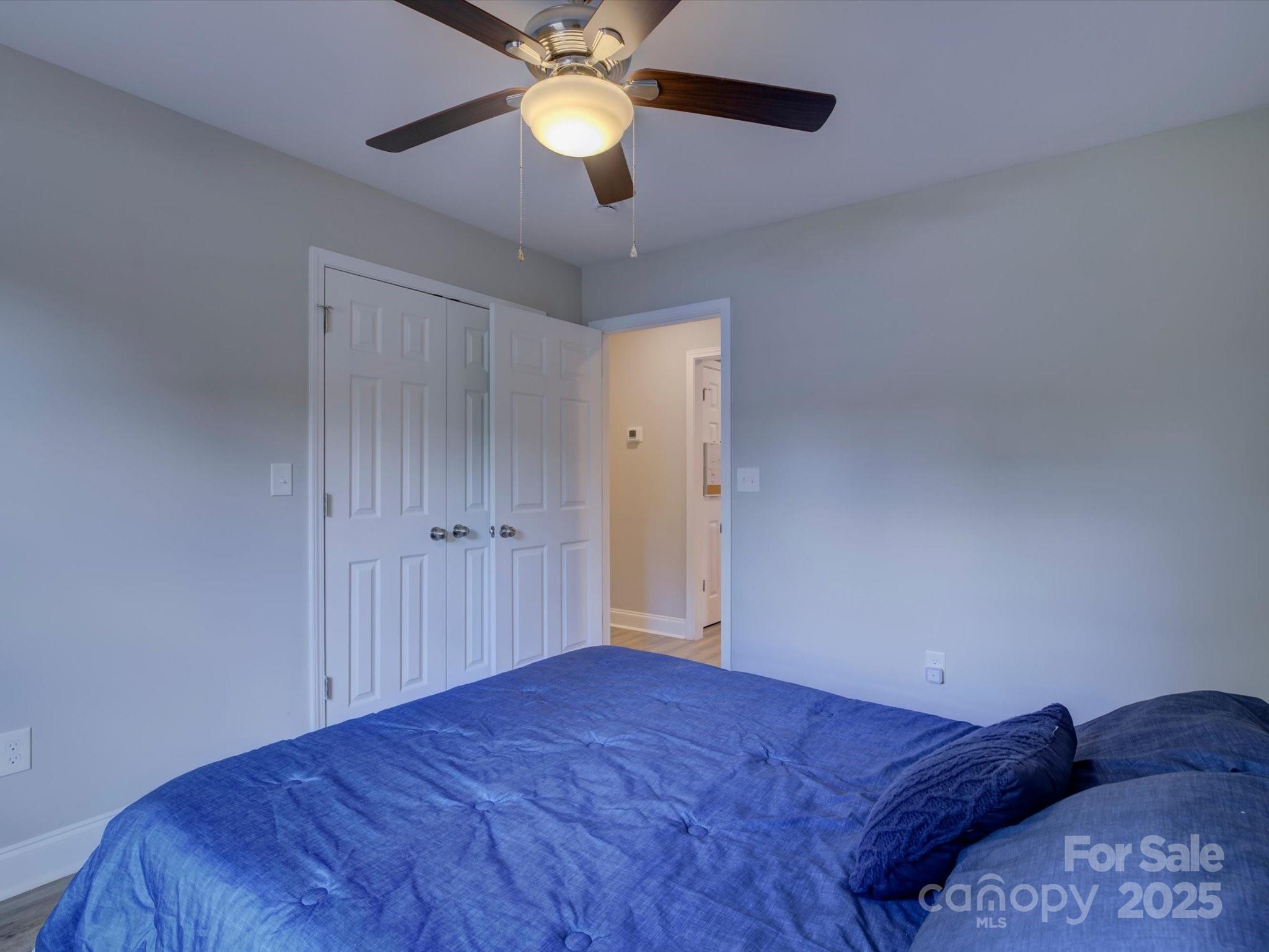 1454 King Road York, SC 29745 - Photo 17 of 34 a bedroom with a bed and a chandelier fan