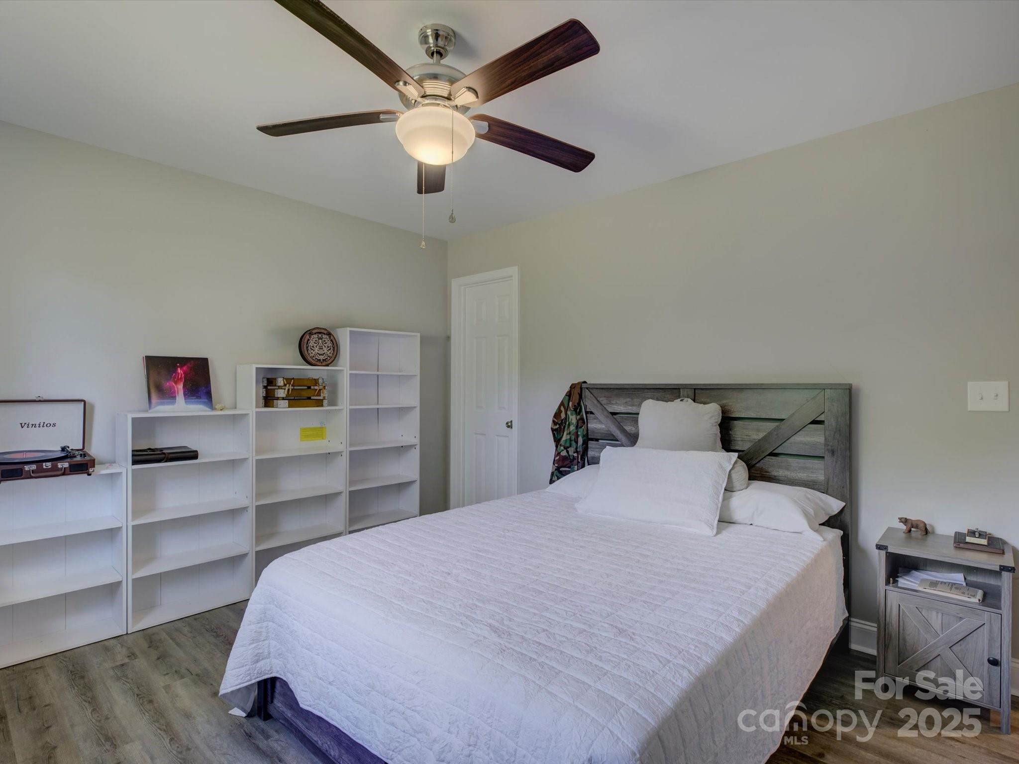 1454 King Road York, SC 29745 - Photo 18 of 34 a bedroom with a bed and a chandelier