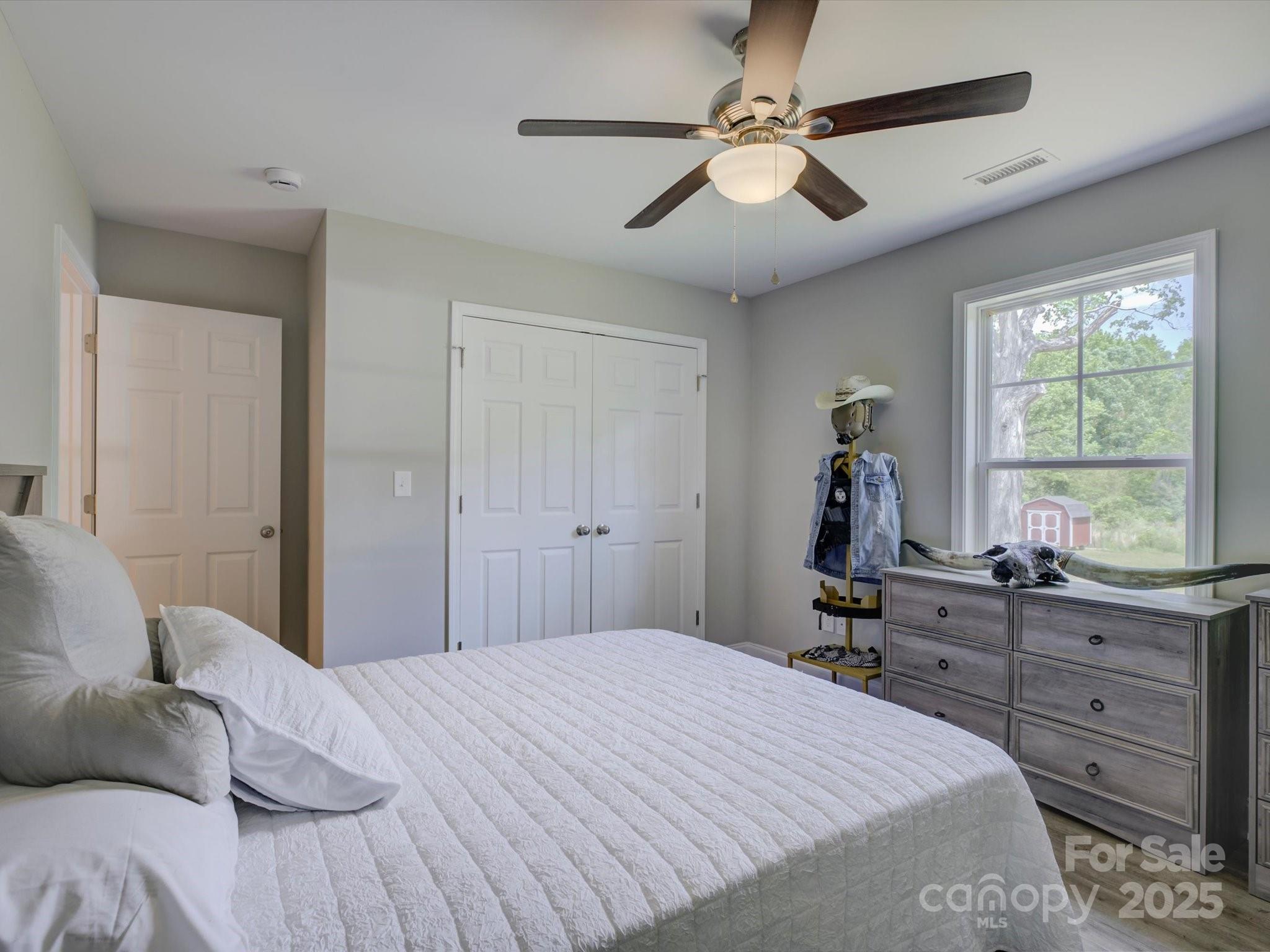 1454 King Road York, SC 29745 - Photo 19 of 34 a bed room with a bed and a dresser