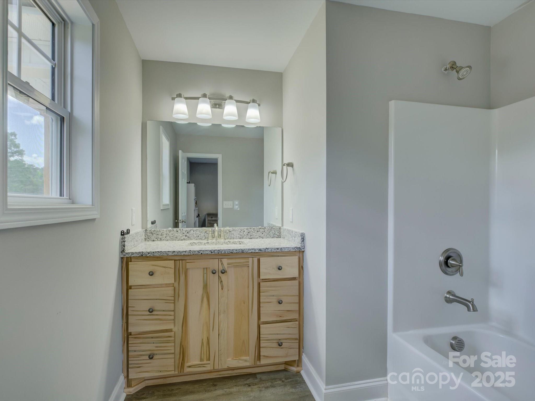 1454 King Road York, SC 29745 - Photo 20 of 34 a bathroom with a granite countertop sink a toilet and shower
