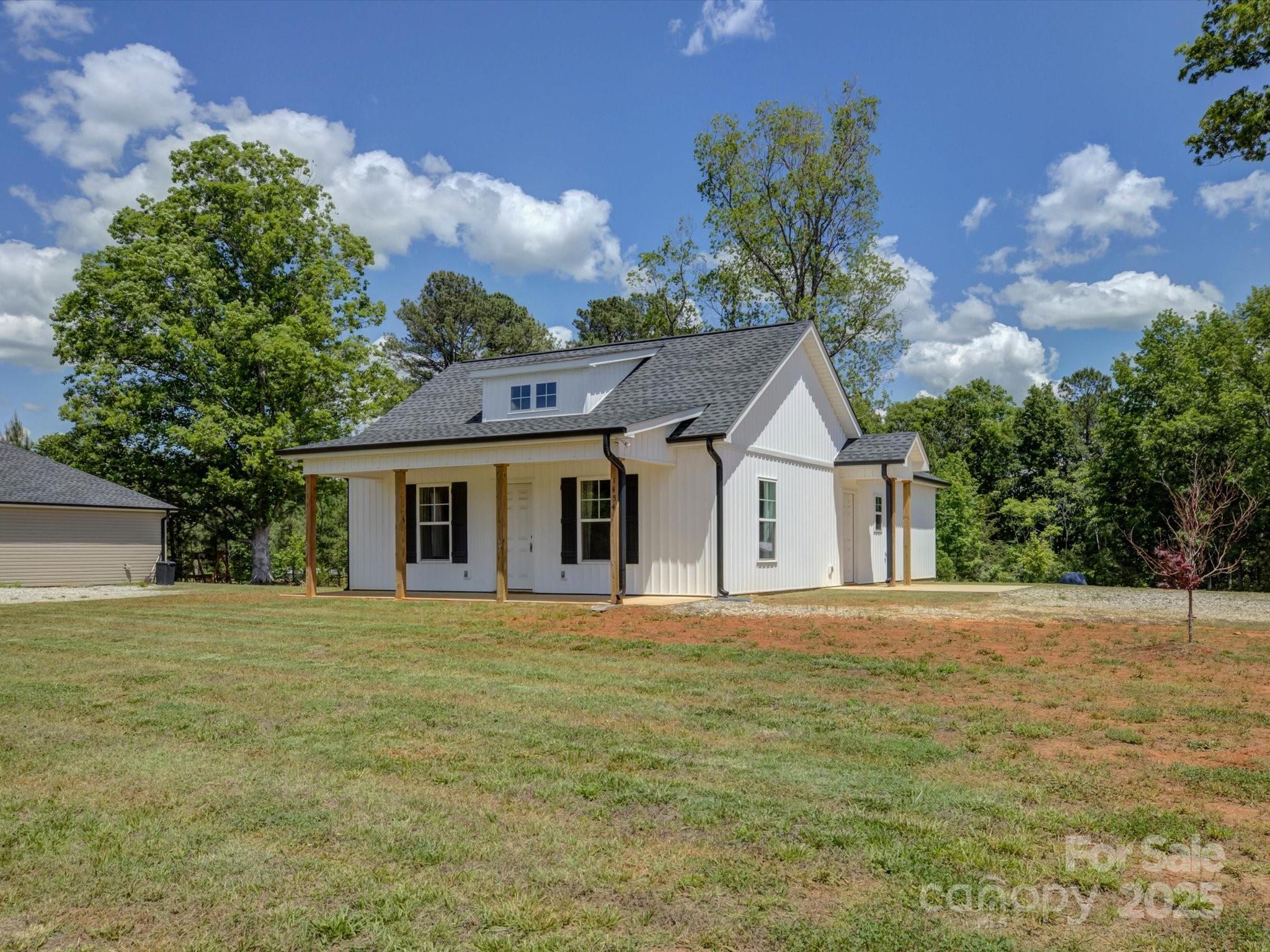 1454 King Road York, SC 29745 - Photo 2 of 34 a front view of a house with a garden and trees