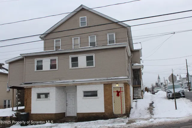 a front view of a house with garage