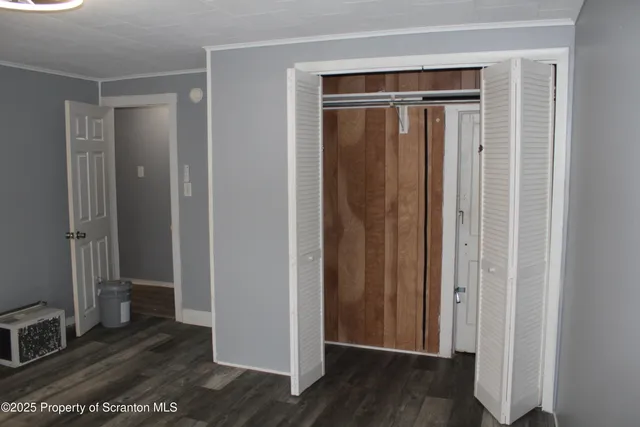 a view of entryway with wooden floor