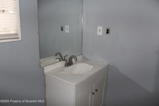 a bathroom with a sink and a vanity