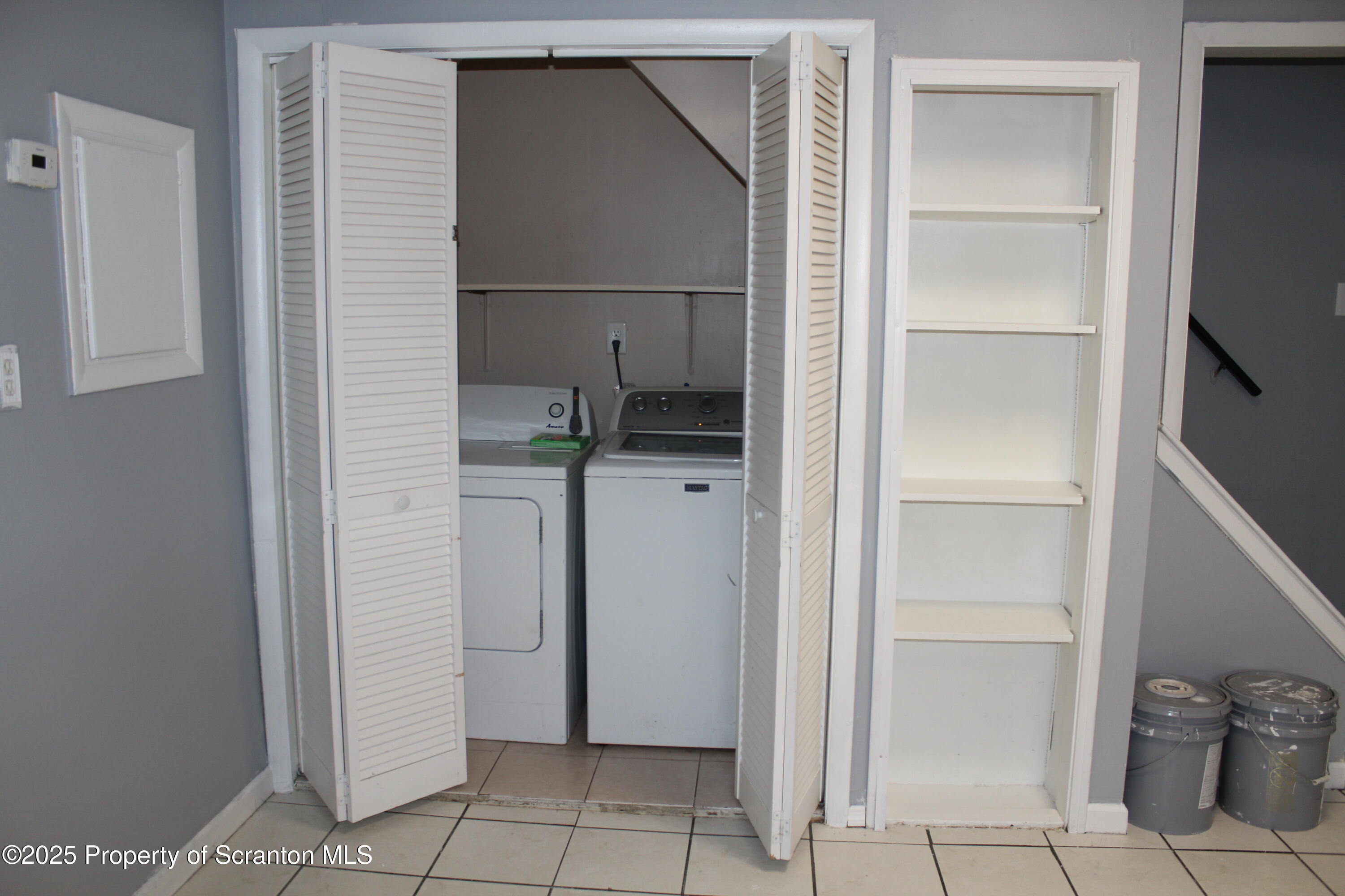 323 Union Street, Unit 1 Taylor, PA 18517 - Photo 9 of 20 a view of walk in closet with empty racks