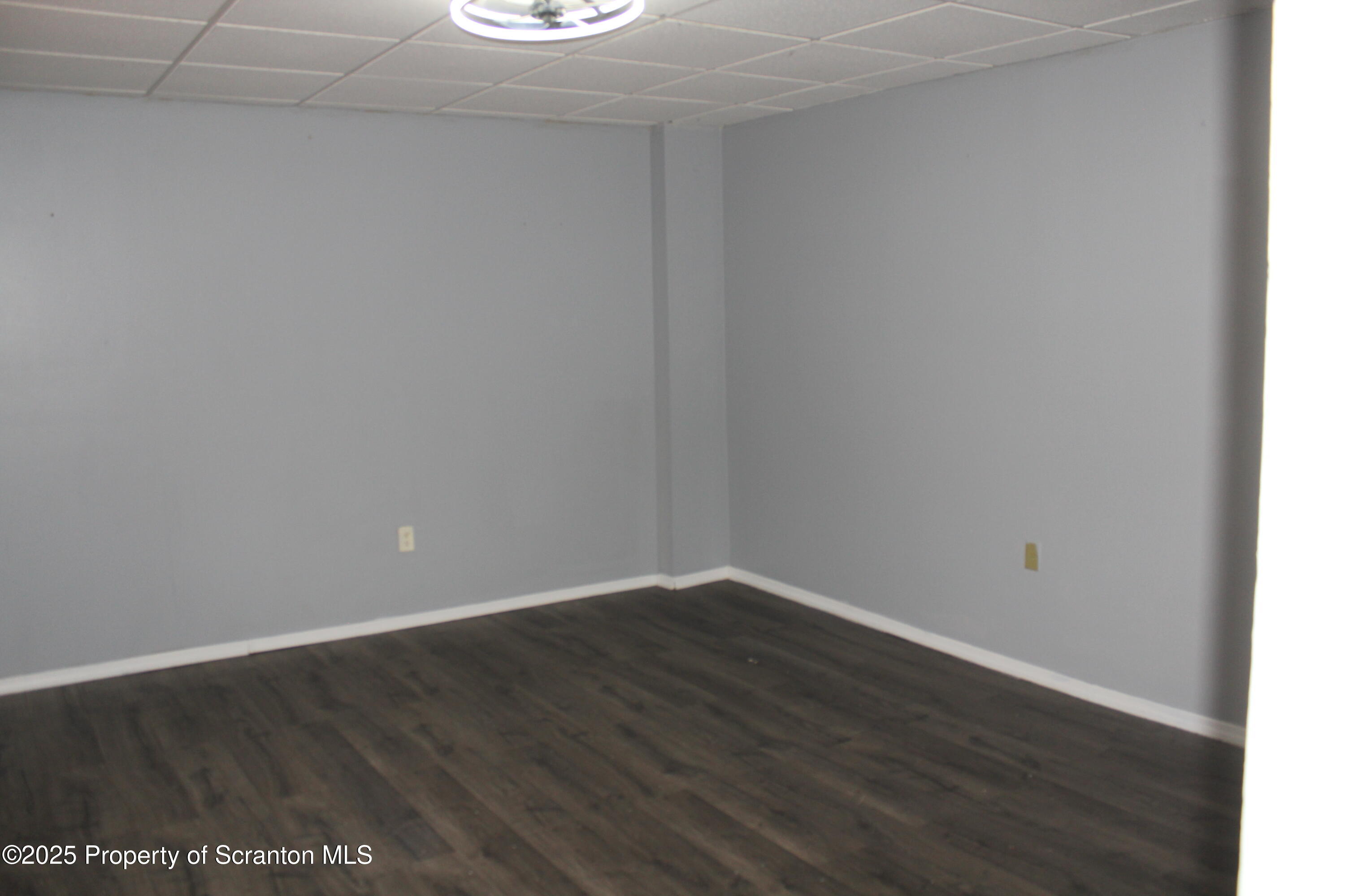 323 Union Street, Unit 1 Taylor, PA 18517 - Photo 10 of 20 a view of an empty room with wooden floor