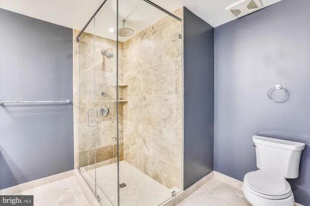 a bathroom with a sink a mirror and a shower