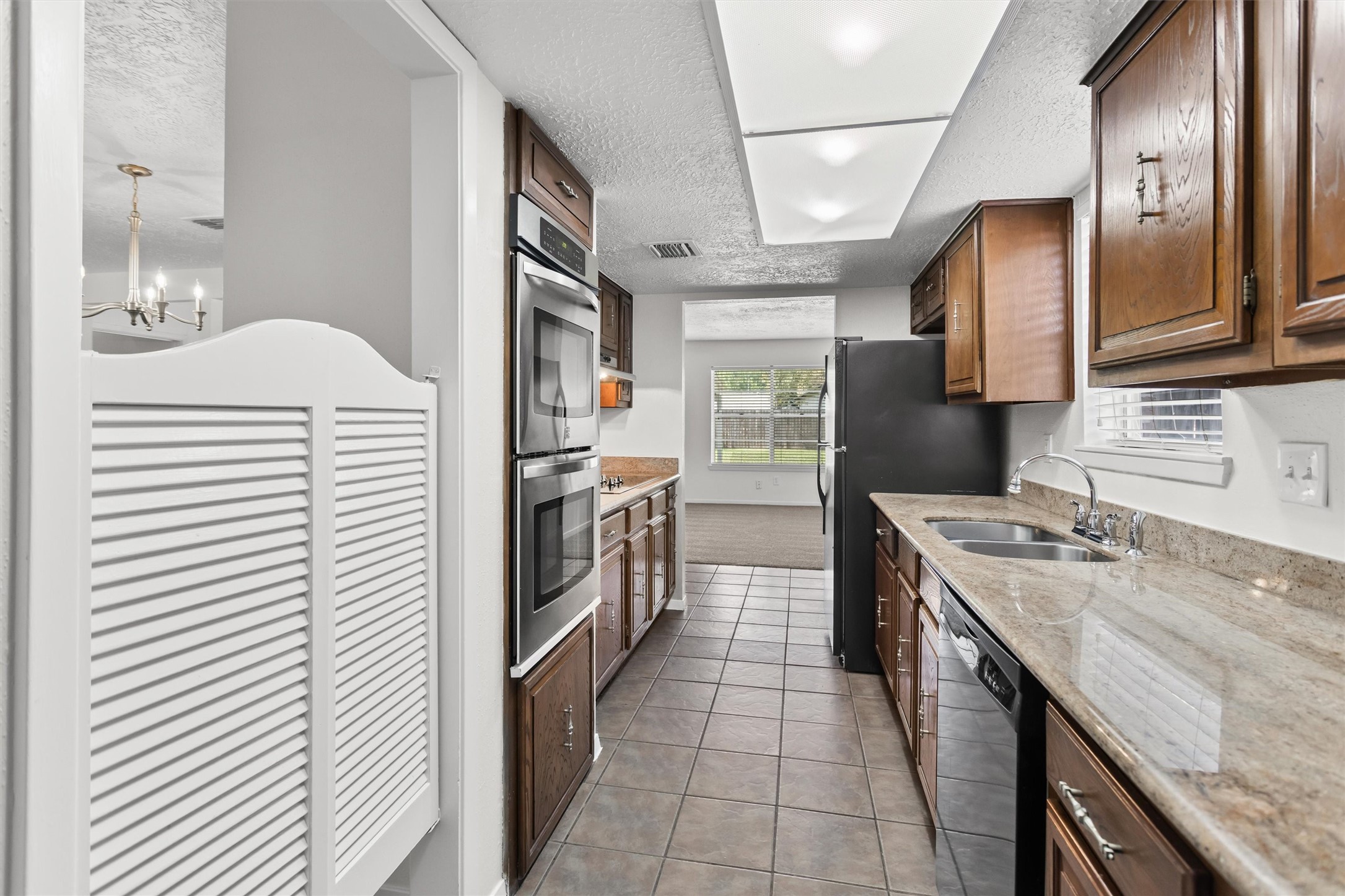 11319 Rousseau Drive Houston, TX 77065 - Photo 10 of 29 Updated kitchen with granite countertops and SS double oven!
