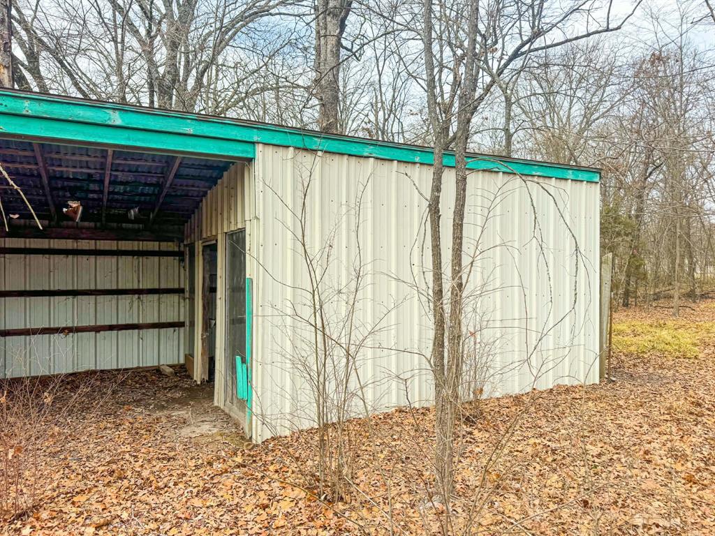 9696 Fm-515 Alba, TX 75410 - Photo 12 of 26 a view of a backyard with wooden fence and large trees