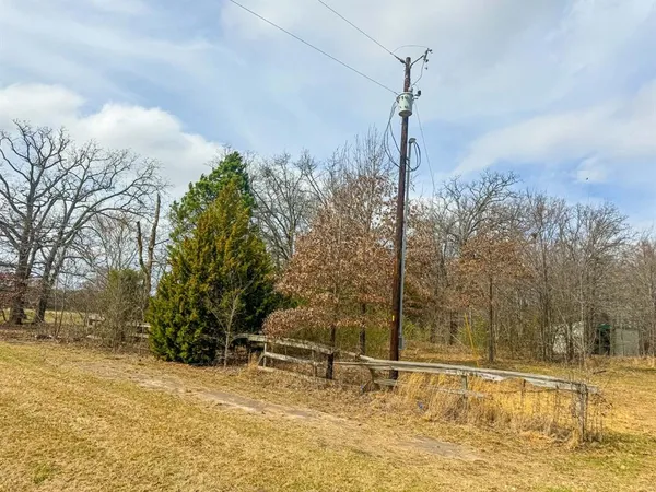 a view of a road with a building in the background