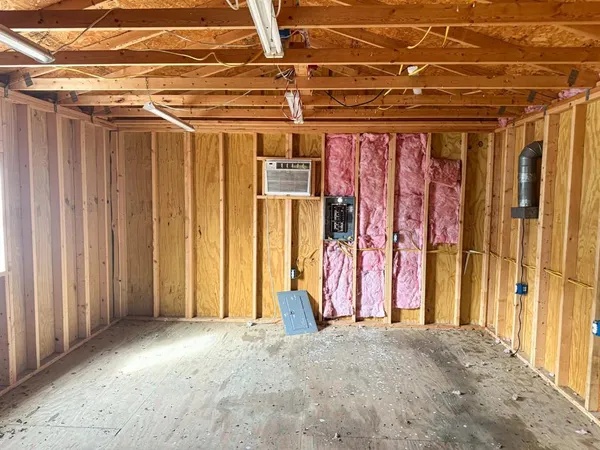 a view of a room with wooden walls