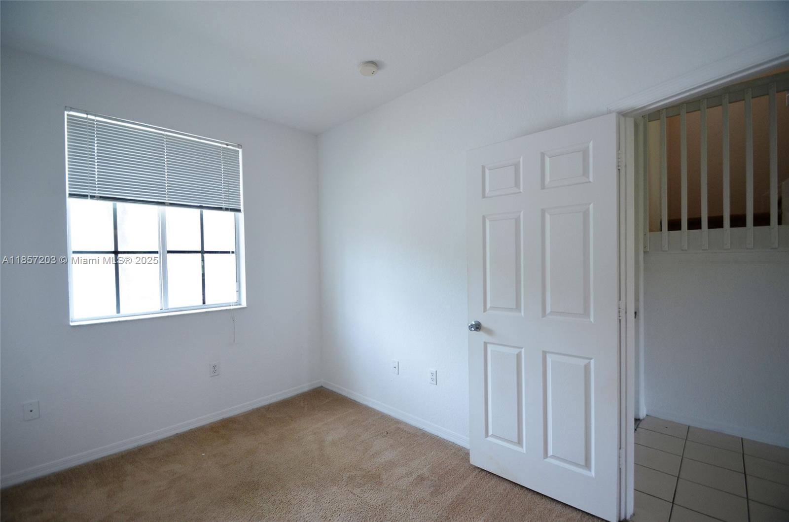 1958 Southwest 60th Terrace, Unit 1958 North Lauderdale, FL 33068 - Photo 7 of 24 an empty room with windows