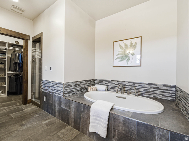 402 Shadow Hill Road Wanship, UT 84017 - Photo 27 of 90 Full bathroom featuring a bath, a spacious closet, a shower stall, and wood finish floors
