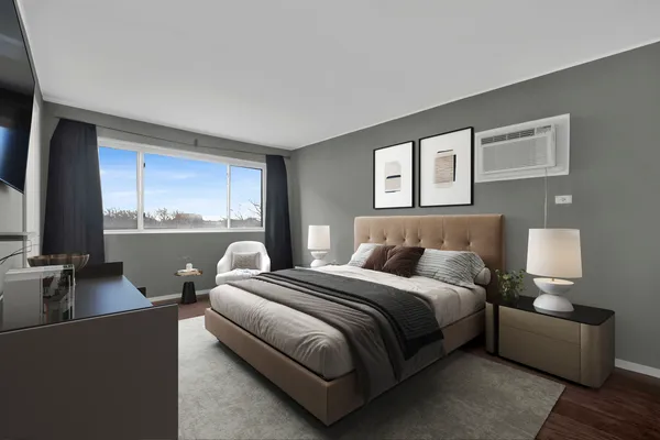 a bedroom with a bed and a couch