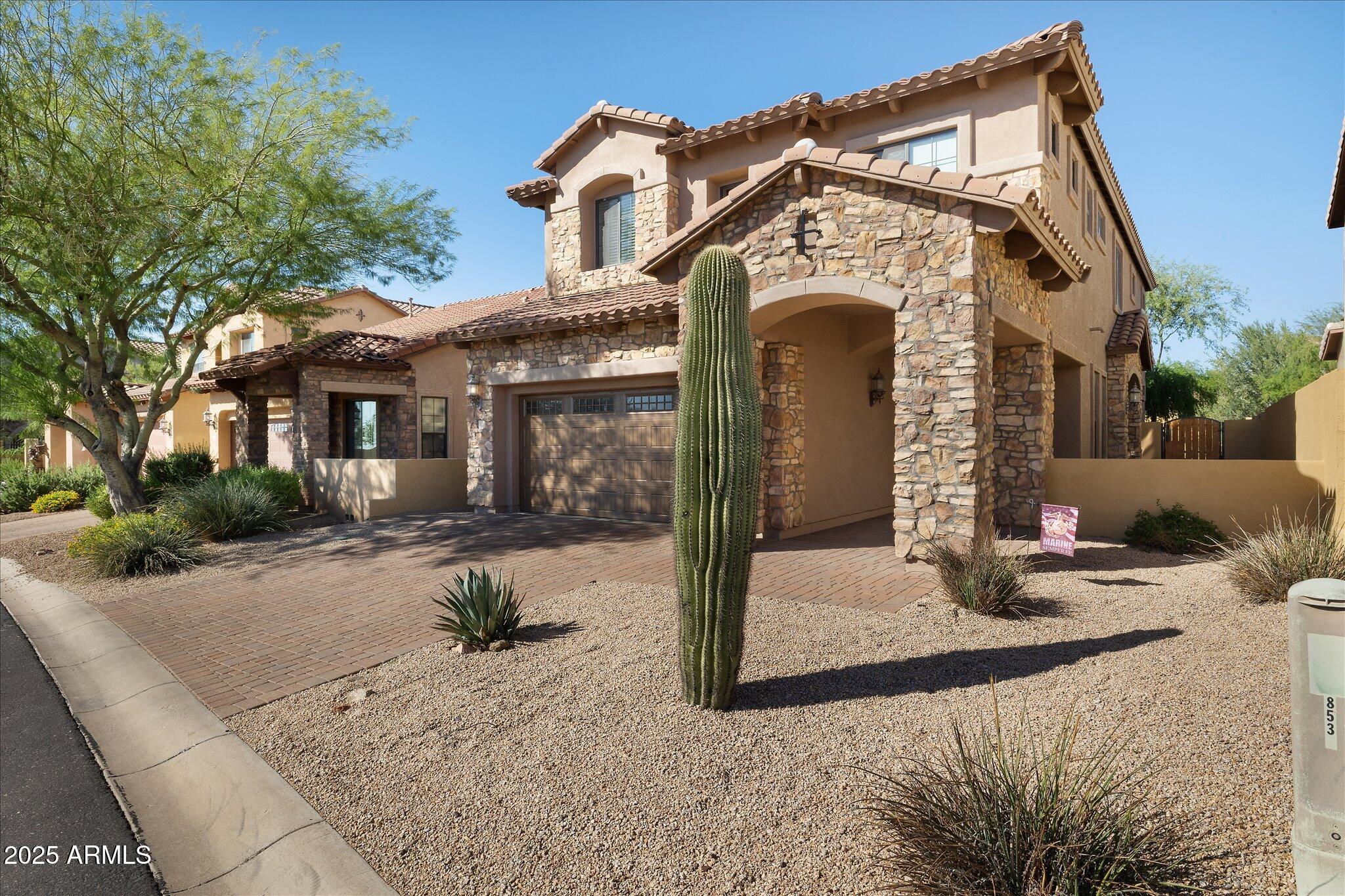 8536 East Inca Street Mesa, AZ 85207 - Photo 1 of 44 a front view of a house with garden