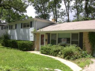 3830 Rugen Road Glenview, IL 60025 - Photo 1 of 1 a front view of a house with garden
