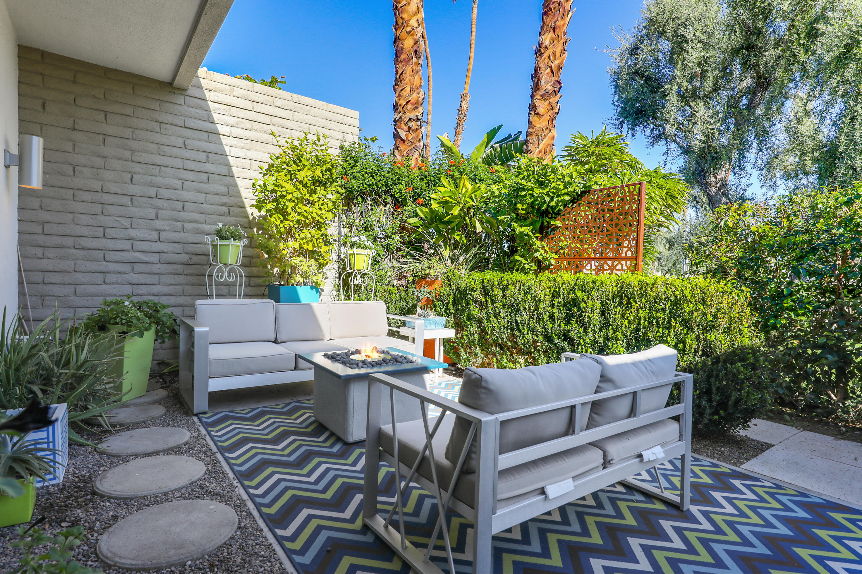 45204 Ave Codorniz Indian Wells, CA 92210 - Photo 26 of 36 a view of a patio with couches and potted plants