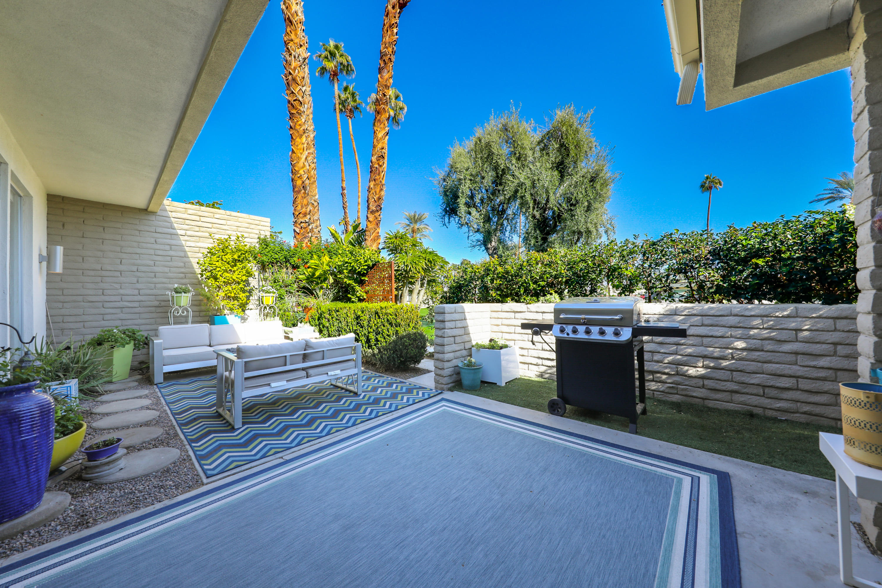 45204 Ave Codorniz Indian Wells, CA 92210 - Photo 28 of 36 a view of a chairs and table in a patio