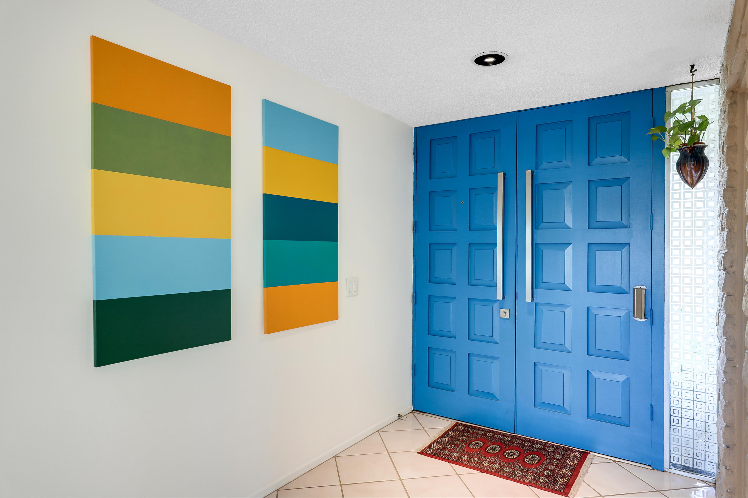 45204 Ave Codorniz Indian Wells, CA 92210 - Photo 4 of 36 a bedroom with a bed and a painting on the wall